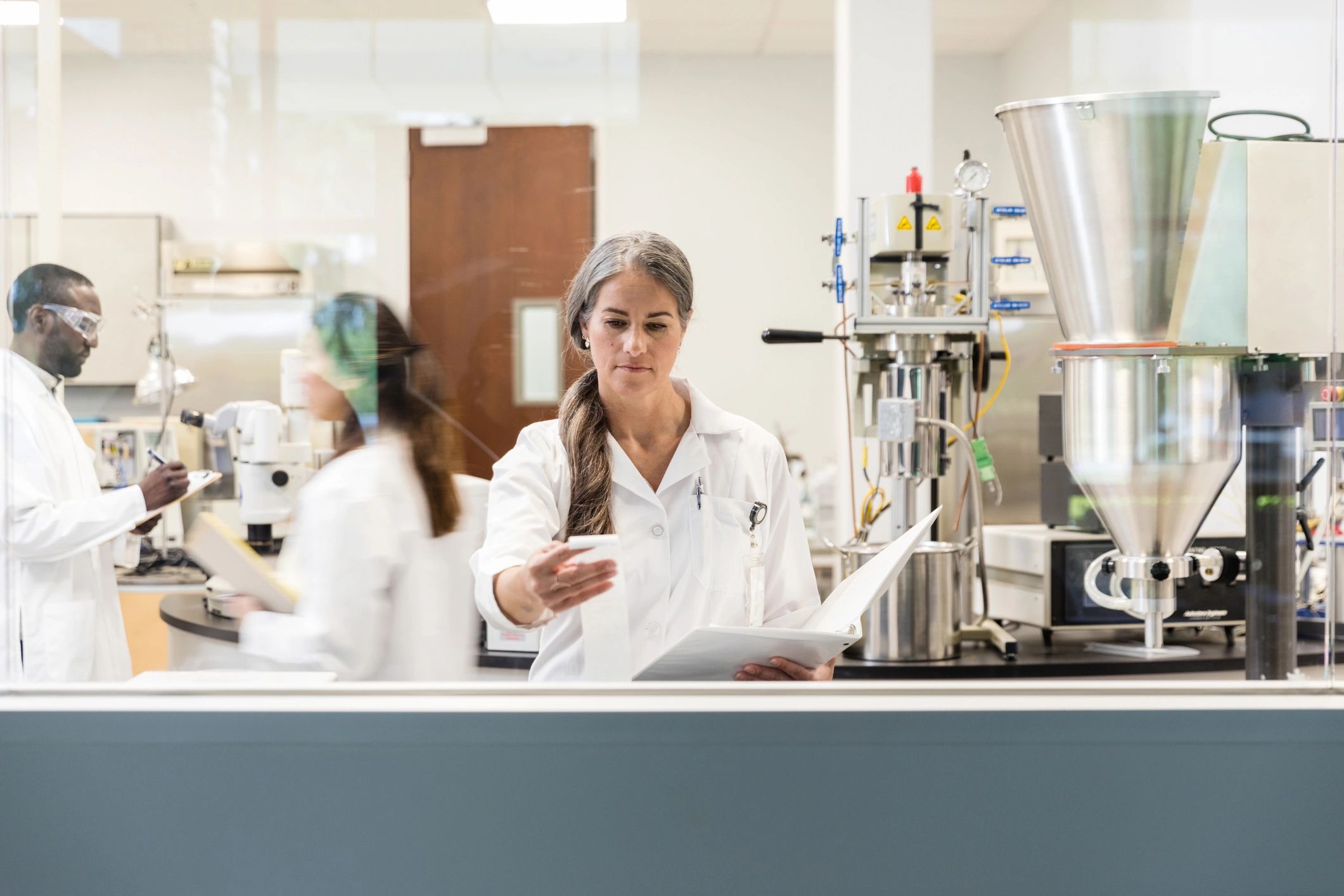 Scientist reviewing test results in a lab